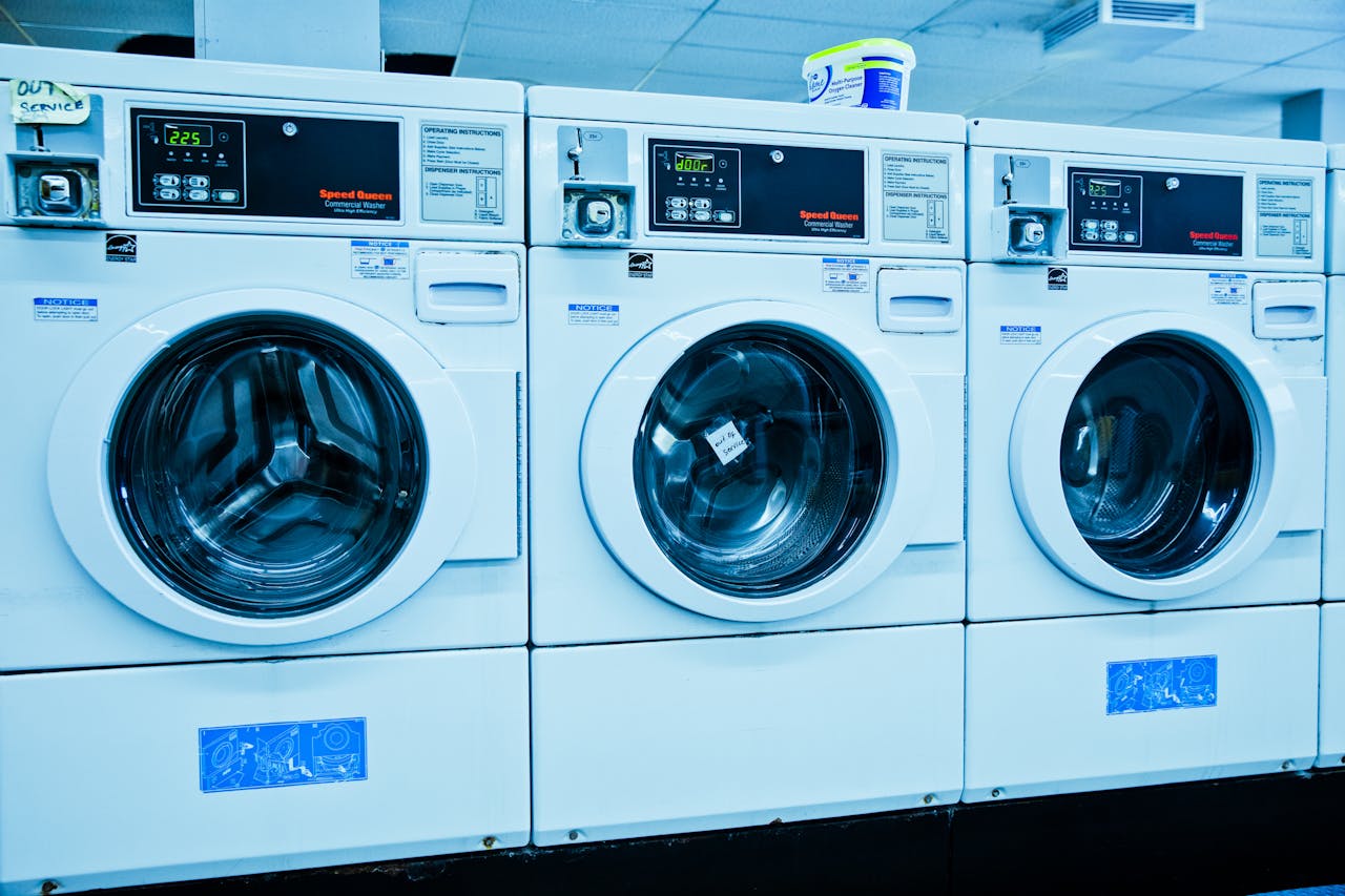 services-01 Contemporary laundromat with automated washing machines. Ideal for laundry and cleaning services.